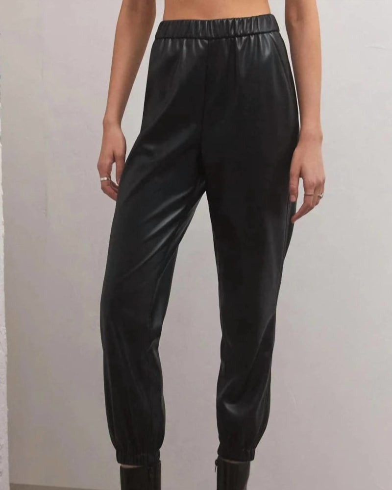 Front of a model wearing a size lrg Lenora Faux Leather Jogger In Black in Black by Z Supply. | dia_product_style_image_id:360290